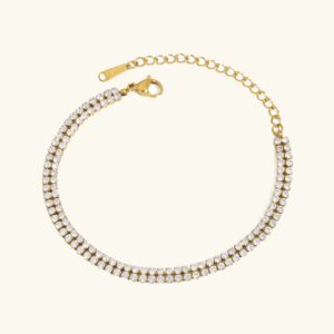 18K gold double tennis bracelet flat lay overhead view showing dual row crystal pavé design with premium gold finish