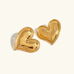 18K gold heart stud earrings polished mirror finish flat lay view on neutral background