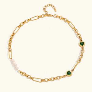 18K gold pearl and heart necklace flat lay display, chunky paperclip chain with freshwater pearls and green zircon heart charms, luxury jewelry photography