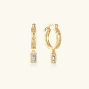 18K gold baguette drop hoop earrings with diamond-studded texture and quilted design, front flat lay view on beige background