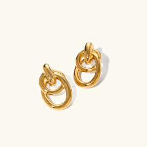 18K gold double loop drop earrings flat lay product photography pristine polished finish interlocking oval links