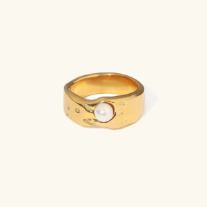 18K gold freshwater pearl ring front flat lay view showing lustrous round white pearl centered on abstract textured gold band against plain white background