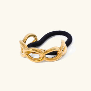 18K gold chain hair tie frontal close-up on white background displaying chunky polished gold chain with black elastic band detail