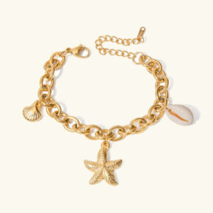 18k gold ocean charm bracelet flat lay starfish shell pearl pendant top view