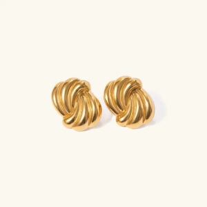 18K gold twisted knot stud earrings flat lay on white background showing bright gold finish and twisted metal texture