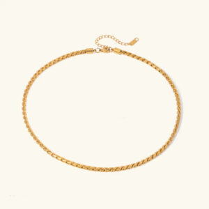 18K gold wheat chain necklace flat lay top view polished twisted link design on beige background