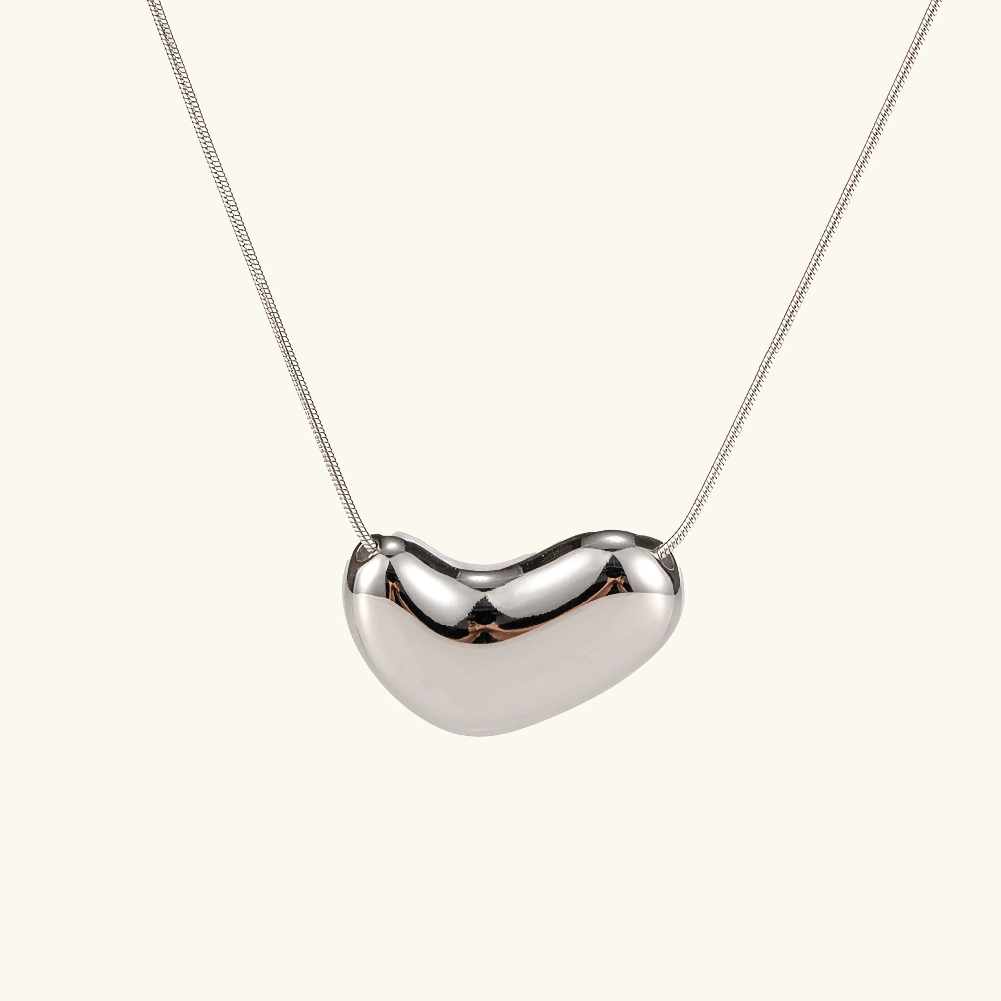 silver bean pendant necklace front flat lay view polished finish thin chain sterling appearance