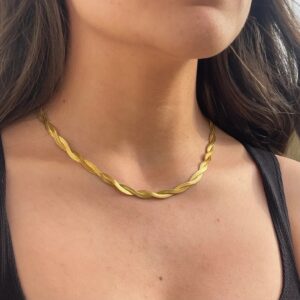 18K gold twisted chain necklace worn on model neck close-up showing flattering fit on dark-haired woman