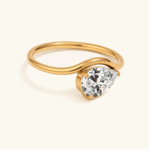 18K gold pear-cut birthstone ring April white gemstone side view studio shot