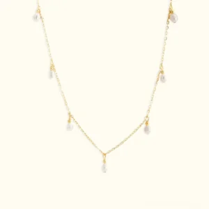 14K gold freshwater pearl pendant necklace flat lay product view with teardrop-shaped pearls on white background