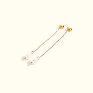 14K gold pearl tassel threader earrings flat lay featuring baroque freshwater pearls with delicate chain detail