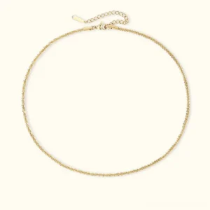 14K gold twisted chain necklace flat lay top view delicate rope design adjustable clasp