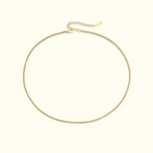 18K gold 2mm slim box chain necklace flat lay with adjustable extension clasp