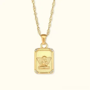 18k gold angel medallion necklace rectangular pendant with diamond simulants flat lay close-up