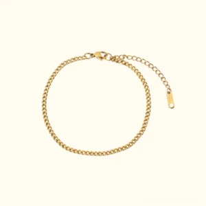 Delicate 18K gold chain anklet flat lay featuring thin link design with adjustable extender clasp, waterproof and hypoallergenic