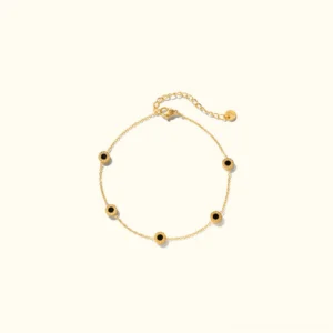 18k gold anklet with freshwater pearls and onyx charms, flat lay overhead view, neutral background, delicate cable chain design