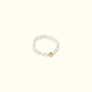 Aurora Pearl Band Ring - 18K gold pearl ring flat lay with rice pearls and gold accent beads