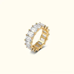18K Gold baguette eternity ring front view, full band pavé diamond simulants, studio flat lay