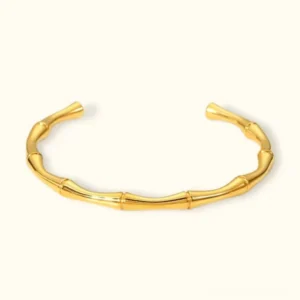 18K gold bamboo joint open cuff bracelet flat lay top view polished finish segmented textured design