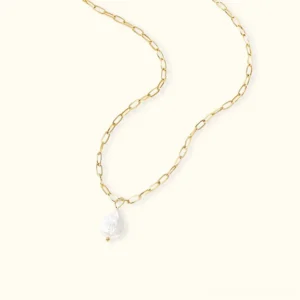 18k gold baroque freshwater pearl necklace with delicate paperclip chain on neutral beige background, flat lay product photography