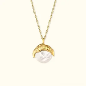 18K gold baroque pearl pendant necklace with hammered gold setting and twisted chain, front flat lay view on neutral background