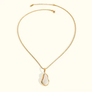 18K gold baroque pearl pendant necklace flat lay overhead view, twisted rope chain with teardrop shaped freshwater pearl