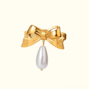18K gold bow hair clip with teardrop freshwater pearl pendant flat lay front view