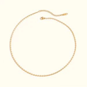 Classic 18K gold cable chain necklace flat lay - delicate linked bead design with polished finish on white background
