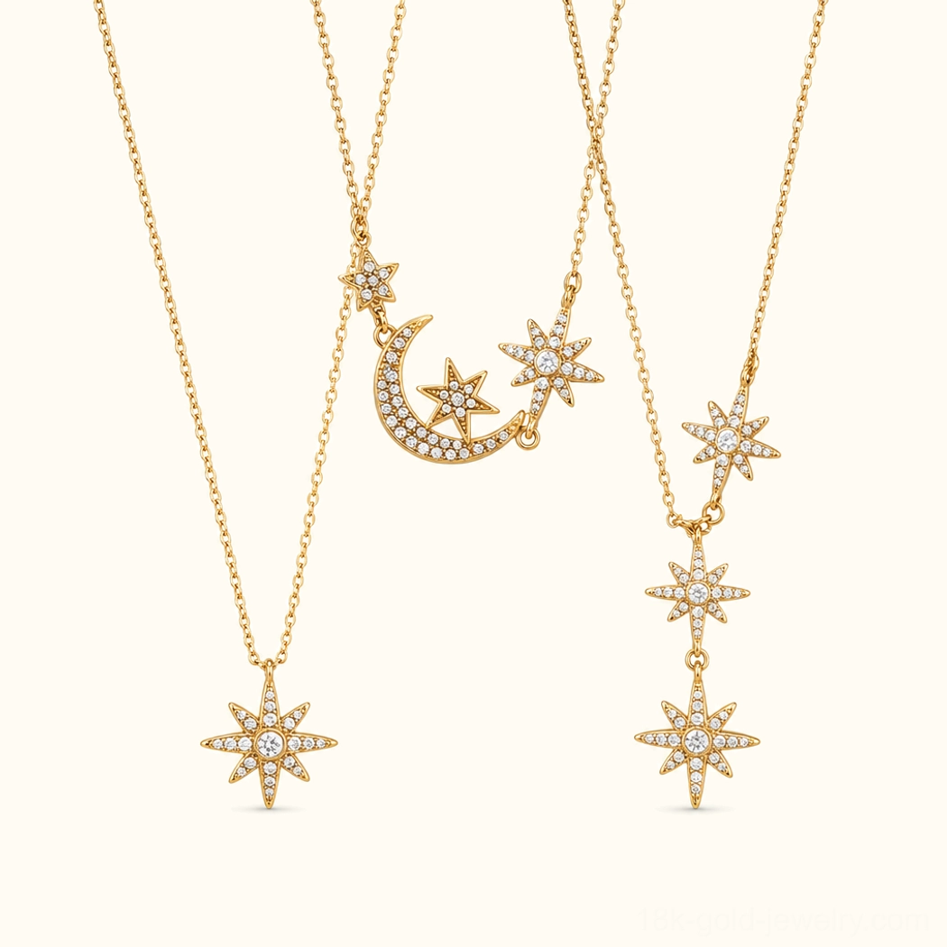 18K gold celestial necklace set flat lay product display three pieces moon star and cascade star pendants beige background