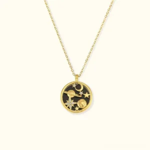 Celestial 18K gold pendant necklace with black enamel star and moon motifs, front view on white background