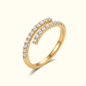 Celestine 18K gold spiral diamond ring flat lay front view showcasing dual pavé wrap design with AAAAA diamond simulants on white background