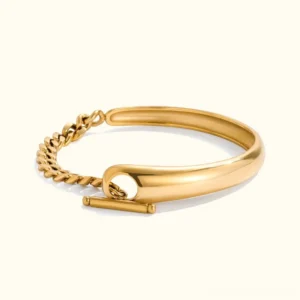 18K gold chain and bangle bracelet with toggle clasp front view studio flat lay on white background showing mixed texture design