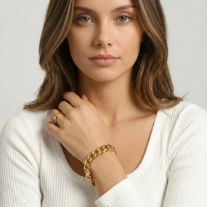 18k gold chain bracelet worn on female model wrist white ribbed top front view
