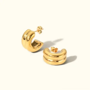 18K gold chunky double-band hoop earrings with smooth polished finish, studio flat lay view on off-white background