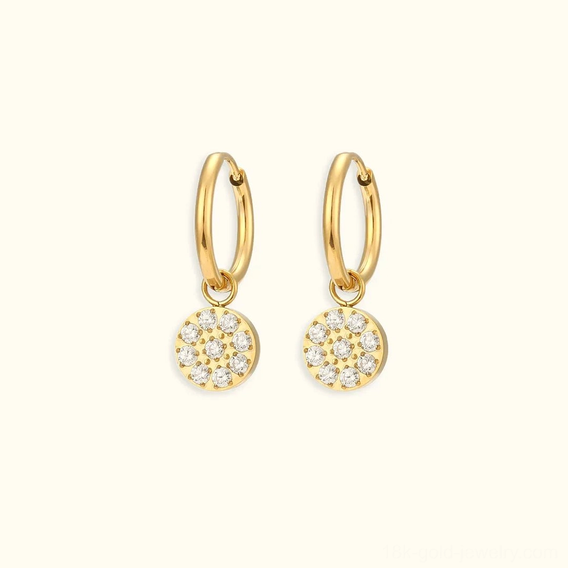 18K gold circle charm huggie hoop earrings minimalist cubic zirconia design flat lay