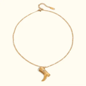 18K gold cowboy boot pendant necklace flat lay - polished gold finish with detailed western boot design