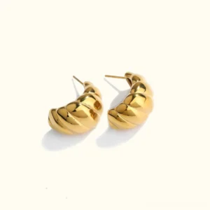 18K Gold Croissant Huggie Earrings - Textured twisted ribbed design flat lay on white background, showing polished gold finish and half-crescent hoop shape