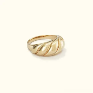 18K gold croissant twisted ridge dome ring flat lay front view polished finish luxury statement