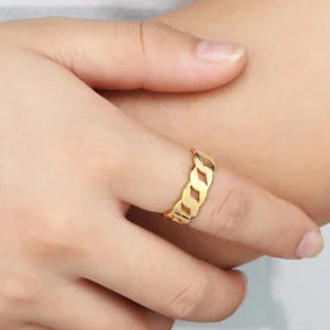 18K gold chain link ring worn on hand close up detail shot finger jewelry