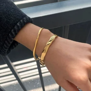 18K gold bangle stacked on female wrist waterproof hypoallergenic bracelet styling