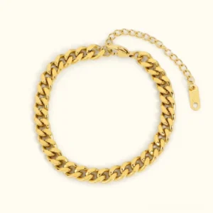18K gold curb chain bracelet flat lay overhead view showing polished gold finish and adjustable extender tag on neutral background