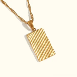 18K gold dahlia pendant necklace with diagonal stripe geometric pattern, front view flat lay with twisted chain