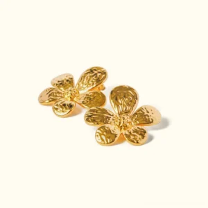 18K gold daisy flower stud earrings with hammered five-petal design, flat lay view on plain background showcasing polished gold center