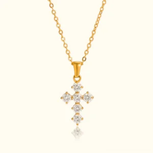 18k gold diamond cross necklace front flat lay view with twisted gold chain and sparkling cubic zirconia stones on plain background