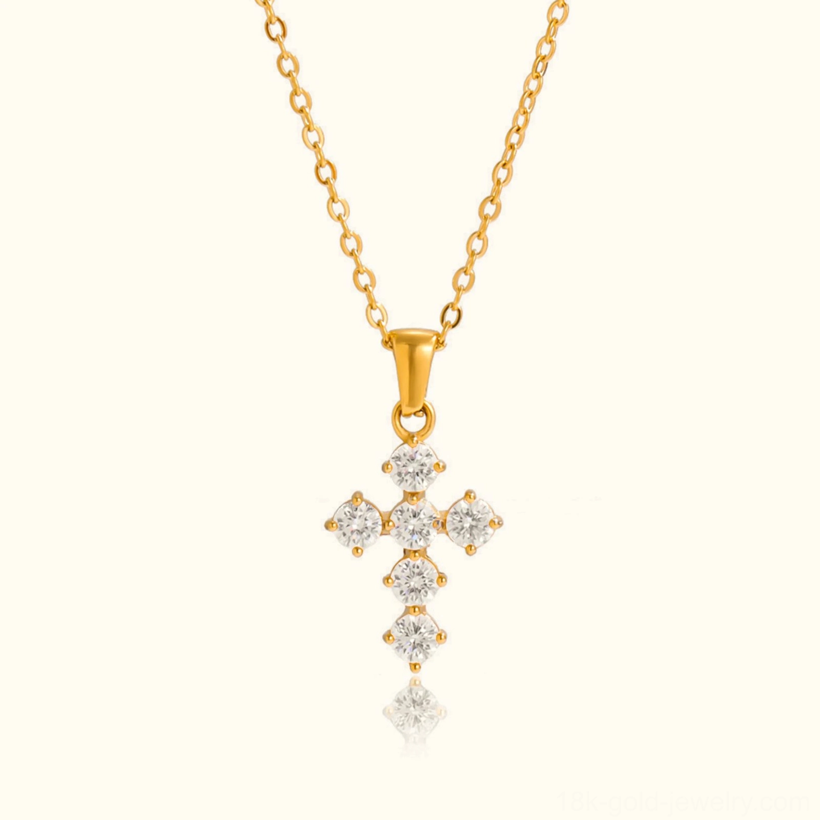 18k gold diamond cross necklace front flat lay view with twisted gold chain and sparkling cubic zirconia stones on plain background