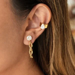 18K gold diamond drop earring and teardrop cuff worn together on ear, close-up side view showing pear-shaped cubic zirconia stone and delicate gold chain design