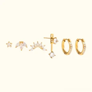 Complete 18K gold diamond earring set of six pieces flat lay top view showing all earring styles including studs hoops and climbers