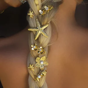18K gold diamond petal hair clip worn in braided hairstyle showing floral design with cubic zirconia sparkle side view