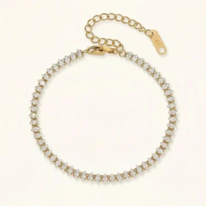 18K gold diamond tennis bracelet with round brilliant cut pavé stones in flat lay studio photography, showing full length adjustable extension chain