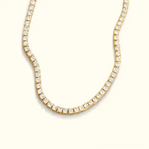 18K gold diamond tennis necklace flat lay overhead view showcasing full chain with square-cut pavé gemstones and polished gold metal